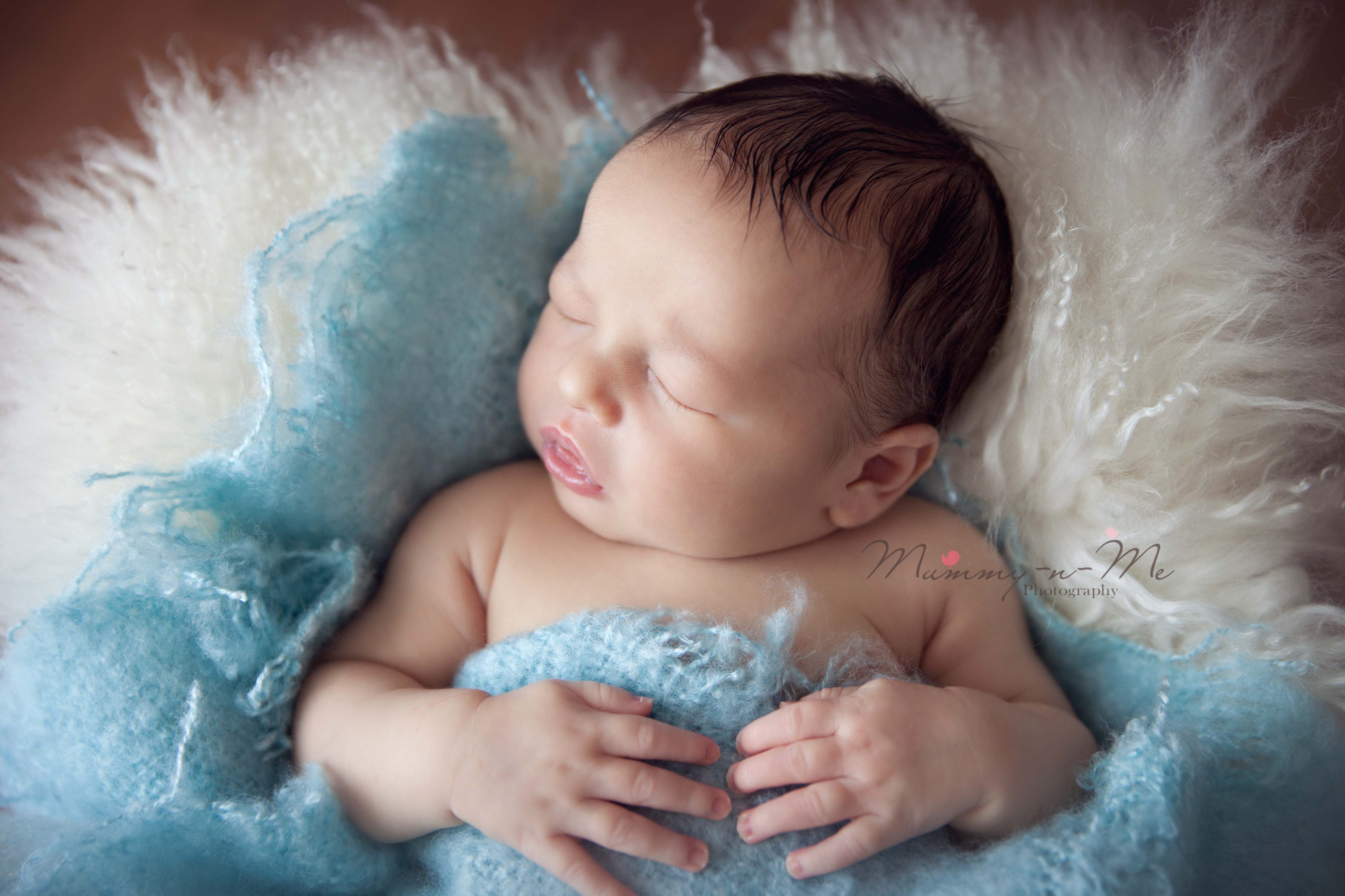 Newborn boy on fur Brisbane newborn photographer