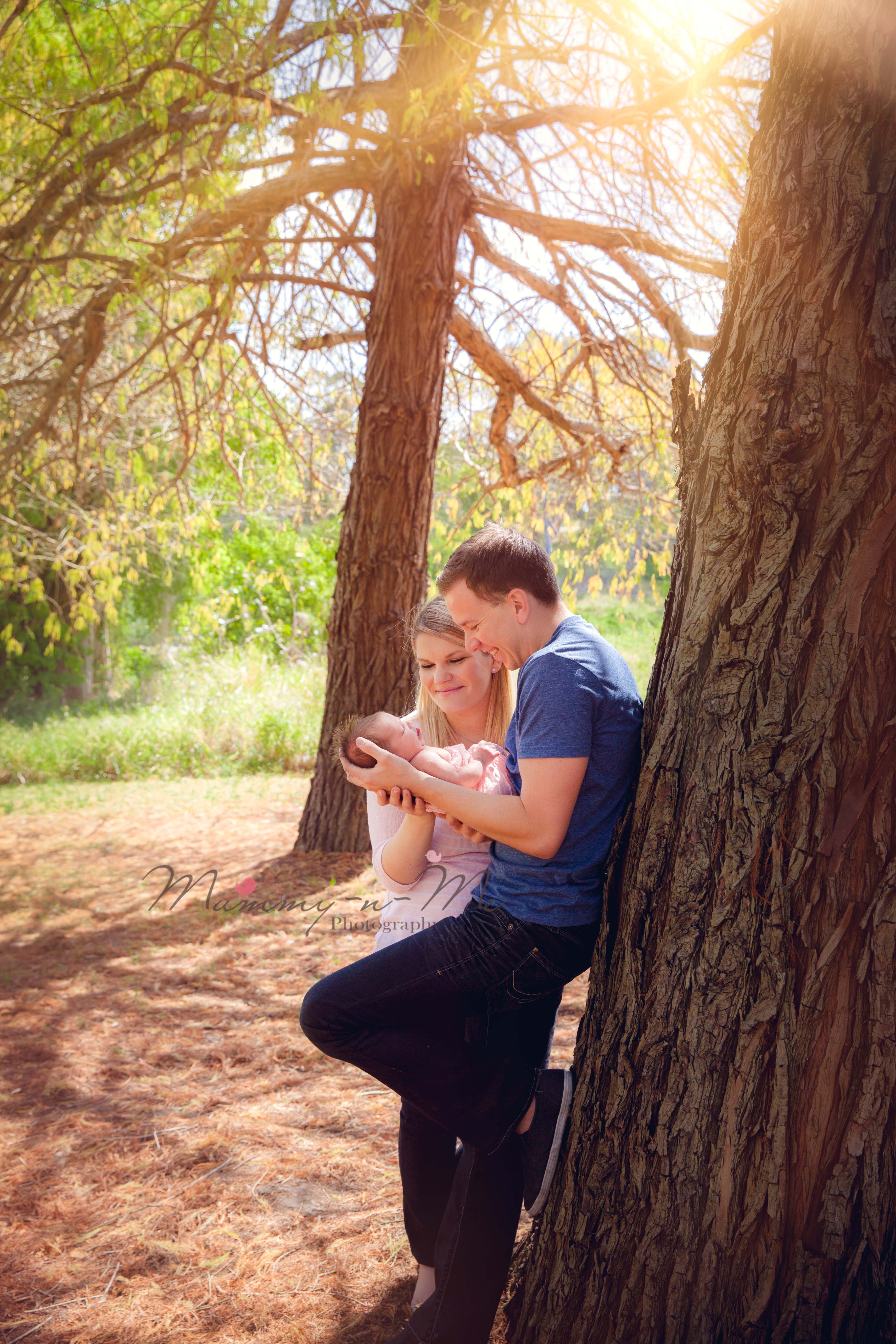 newborn girl outdoor at the park with family Brisbane newborn family photographer