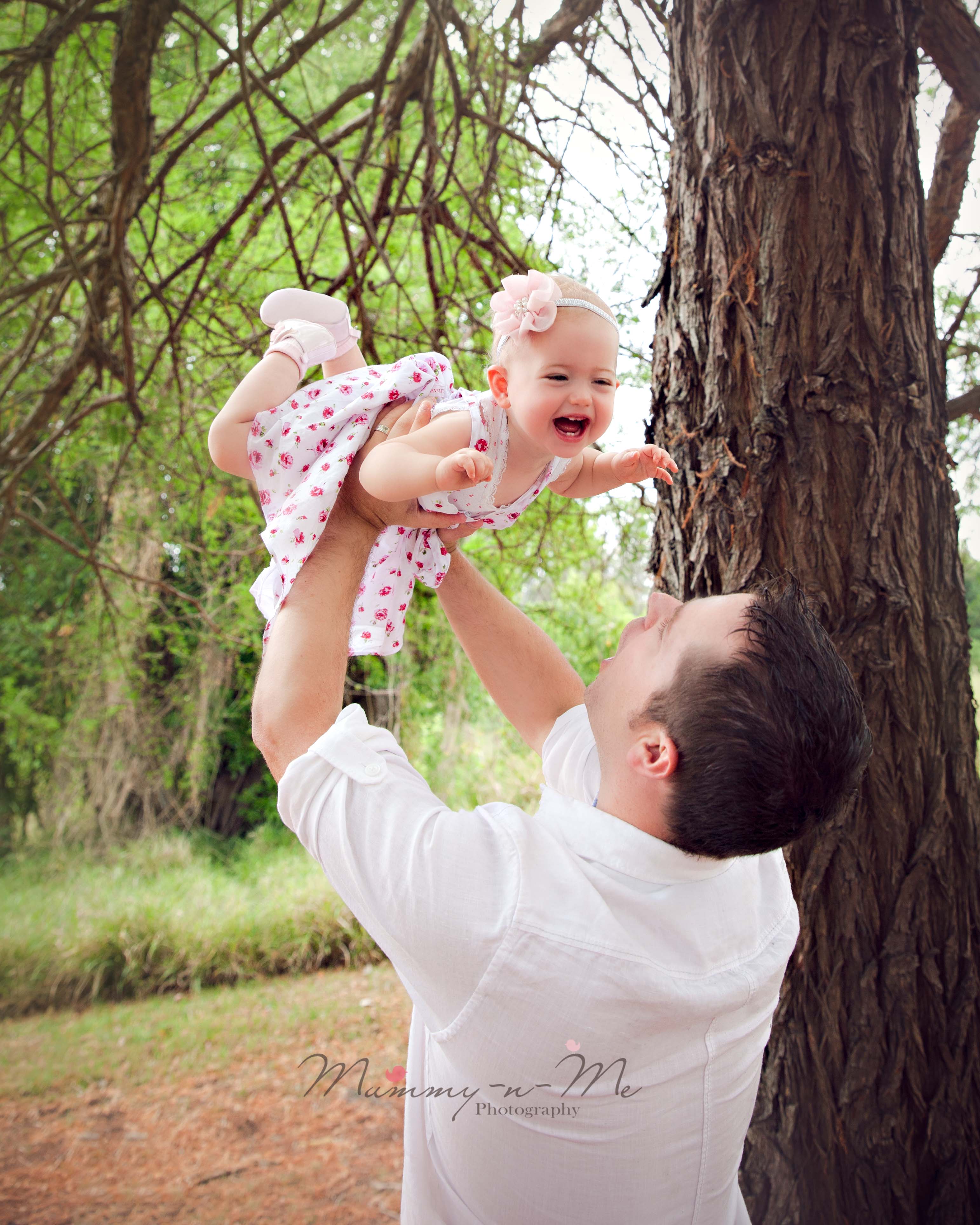 outdoor cakesmash first birthday girl with family Brisbane Cake Smash Photographer