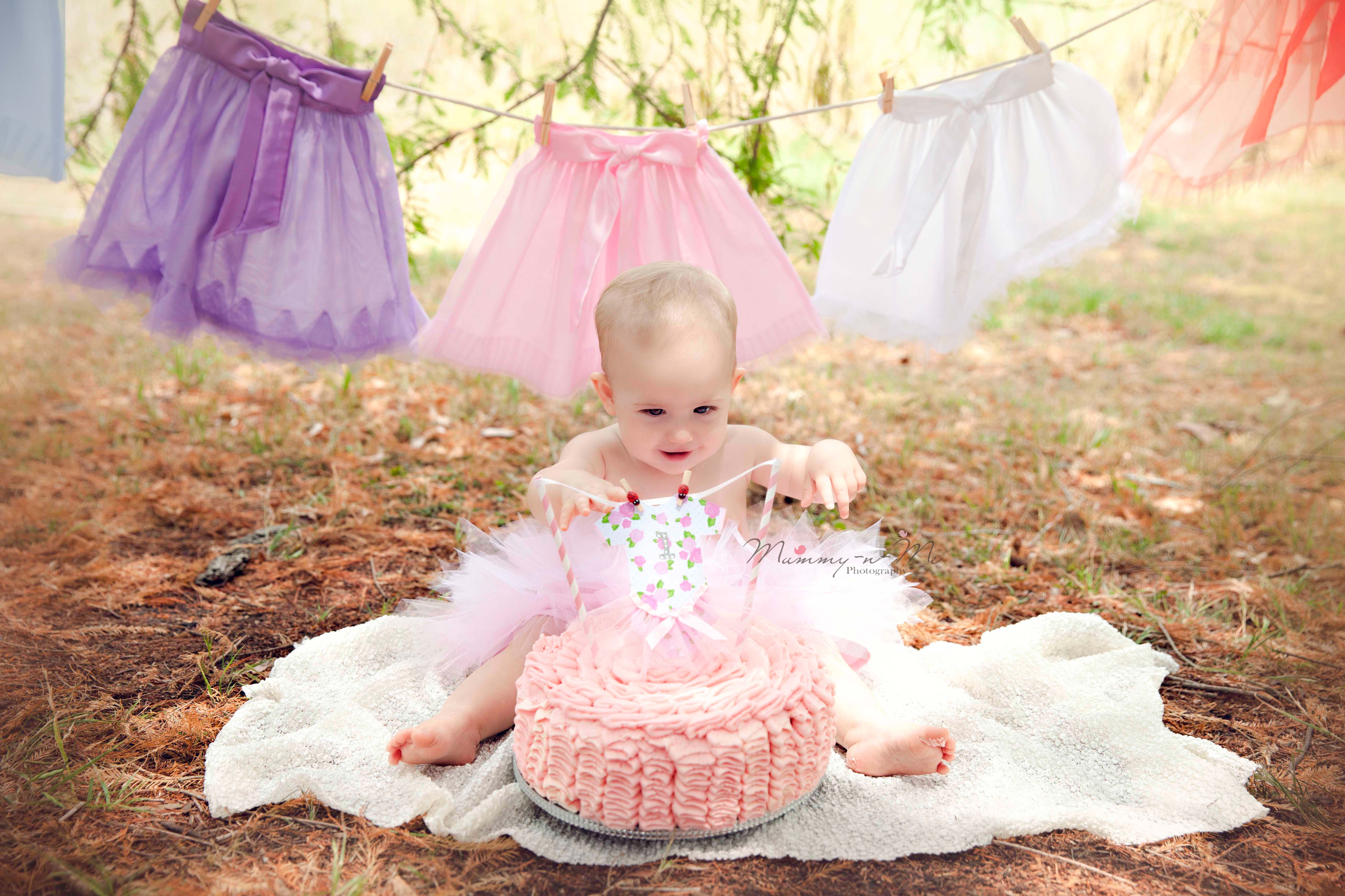 girl with cake in tutu at park  Brisbane Cake Smash Photographer