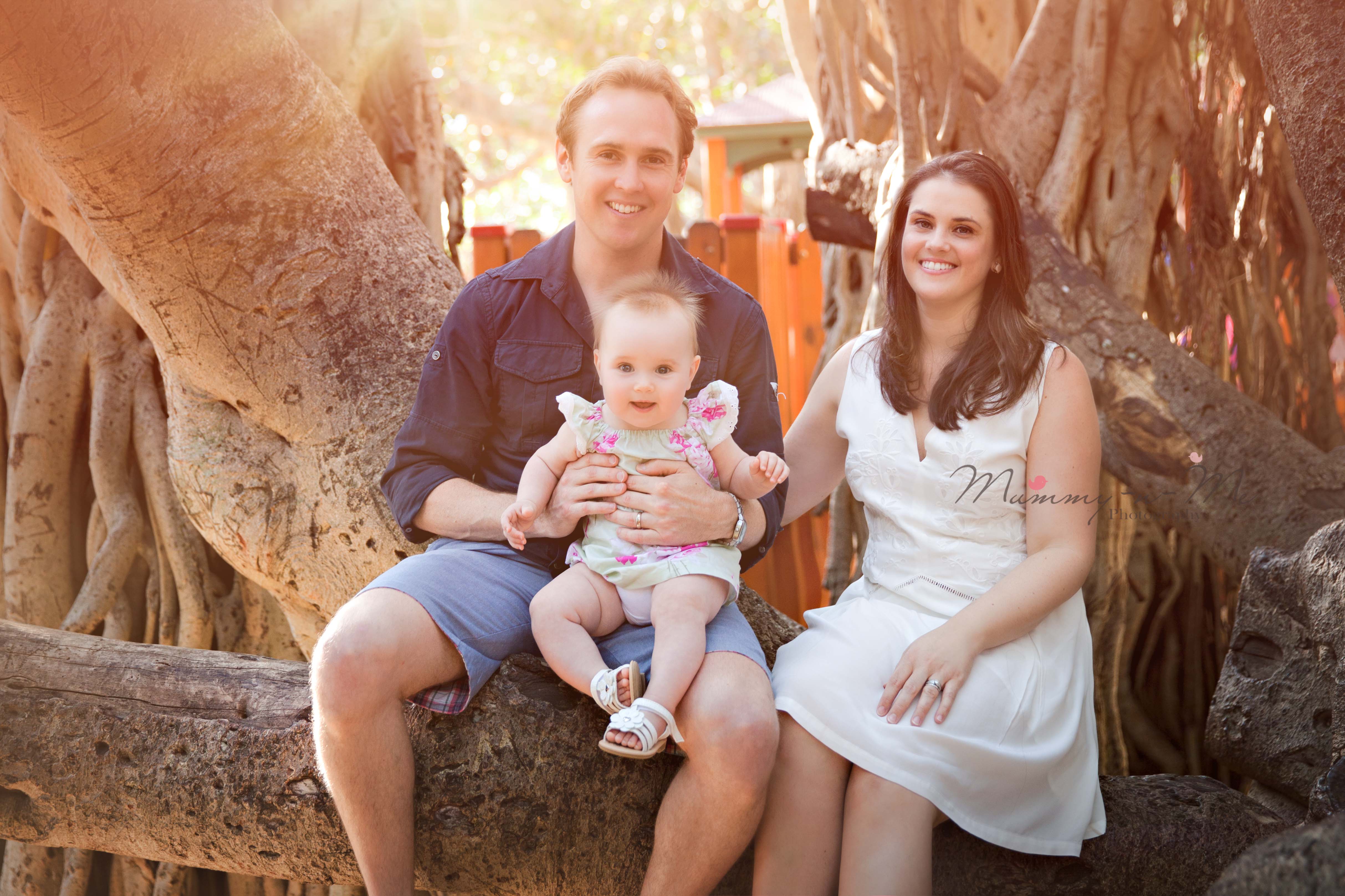6 month girl with family at park Brisbane baby photographer