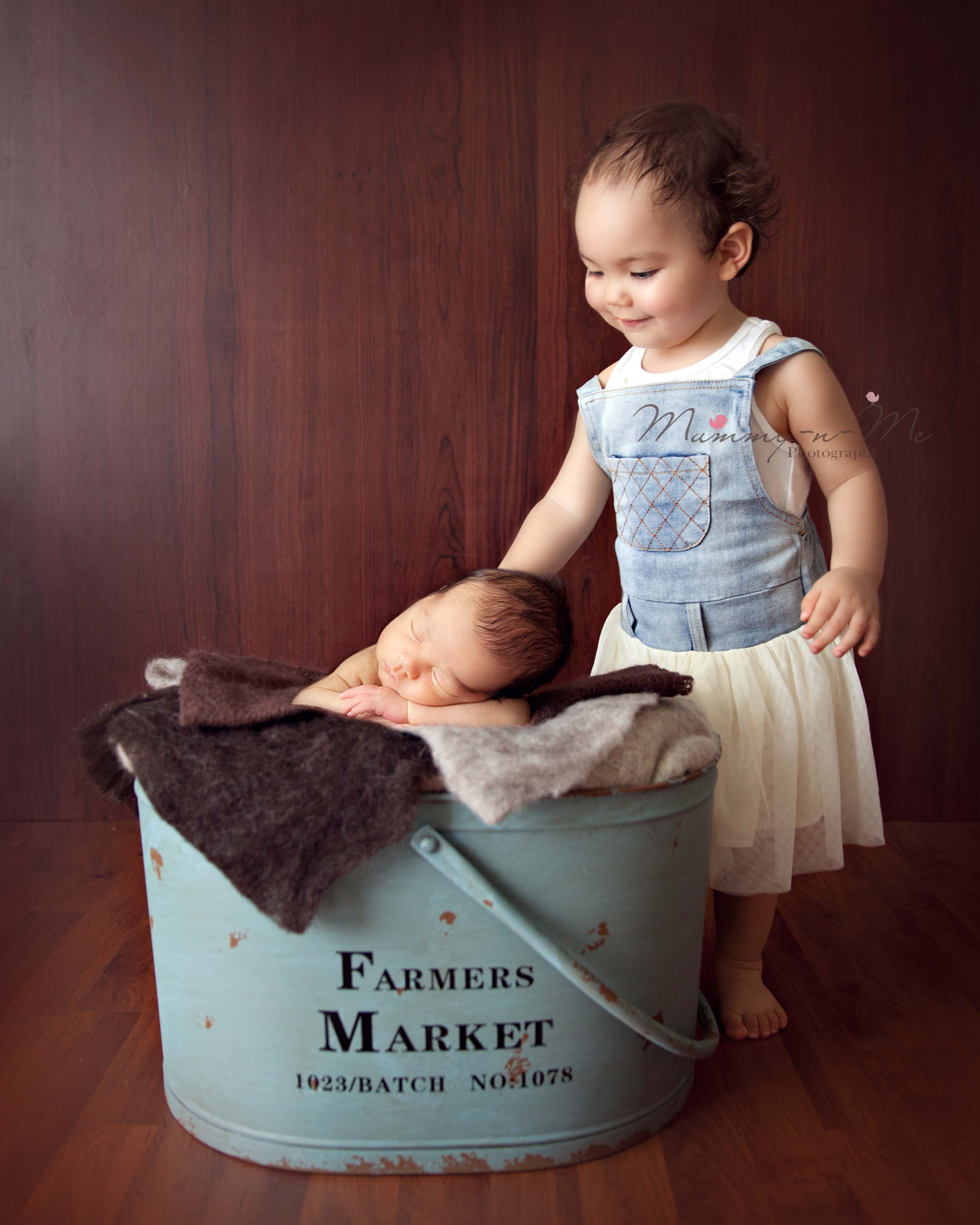 newborn boy with sibbling in basket brisbane newborn photographer