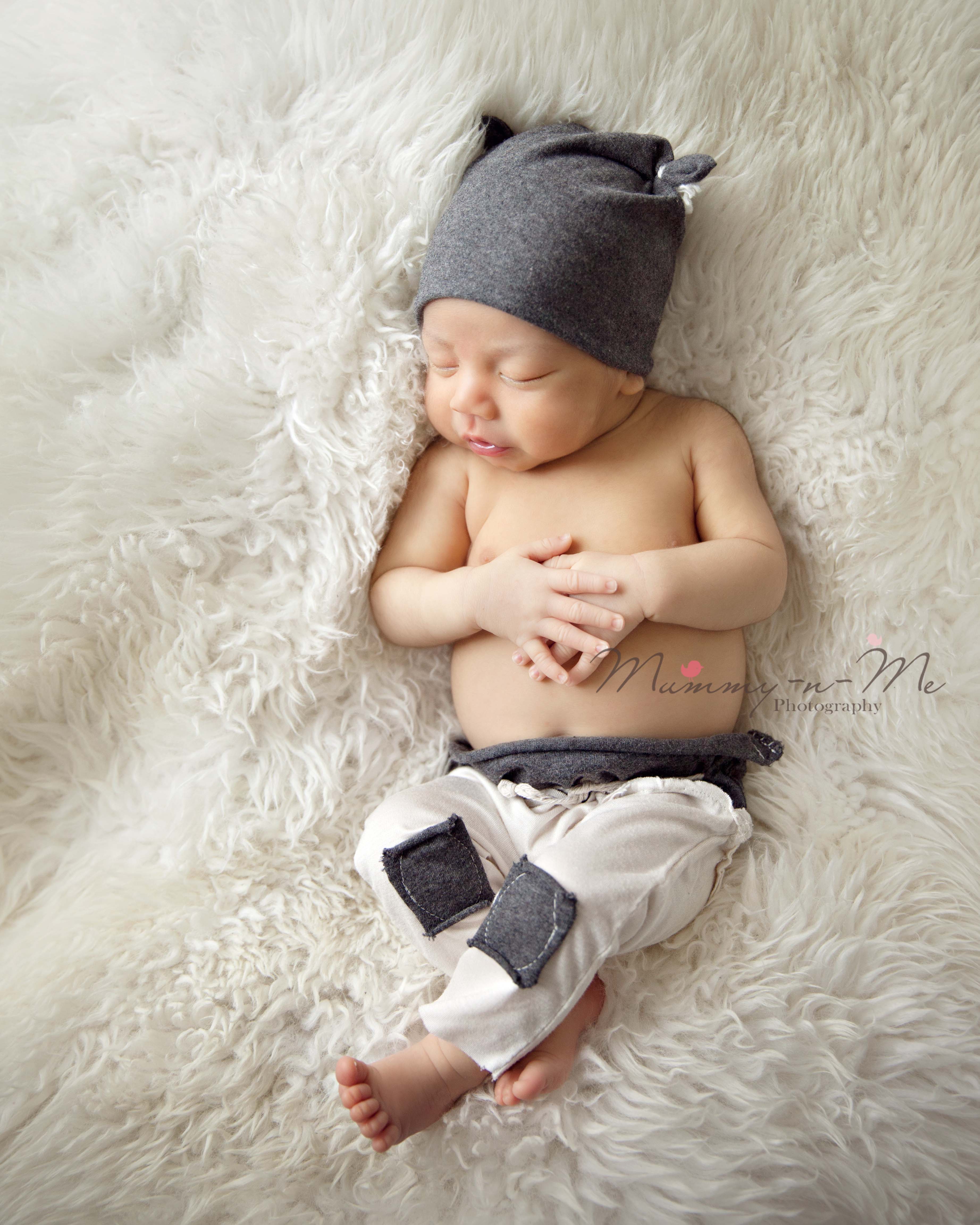 newborn boy in cute designer outfit brisbane newborn photographer