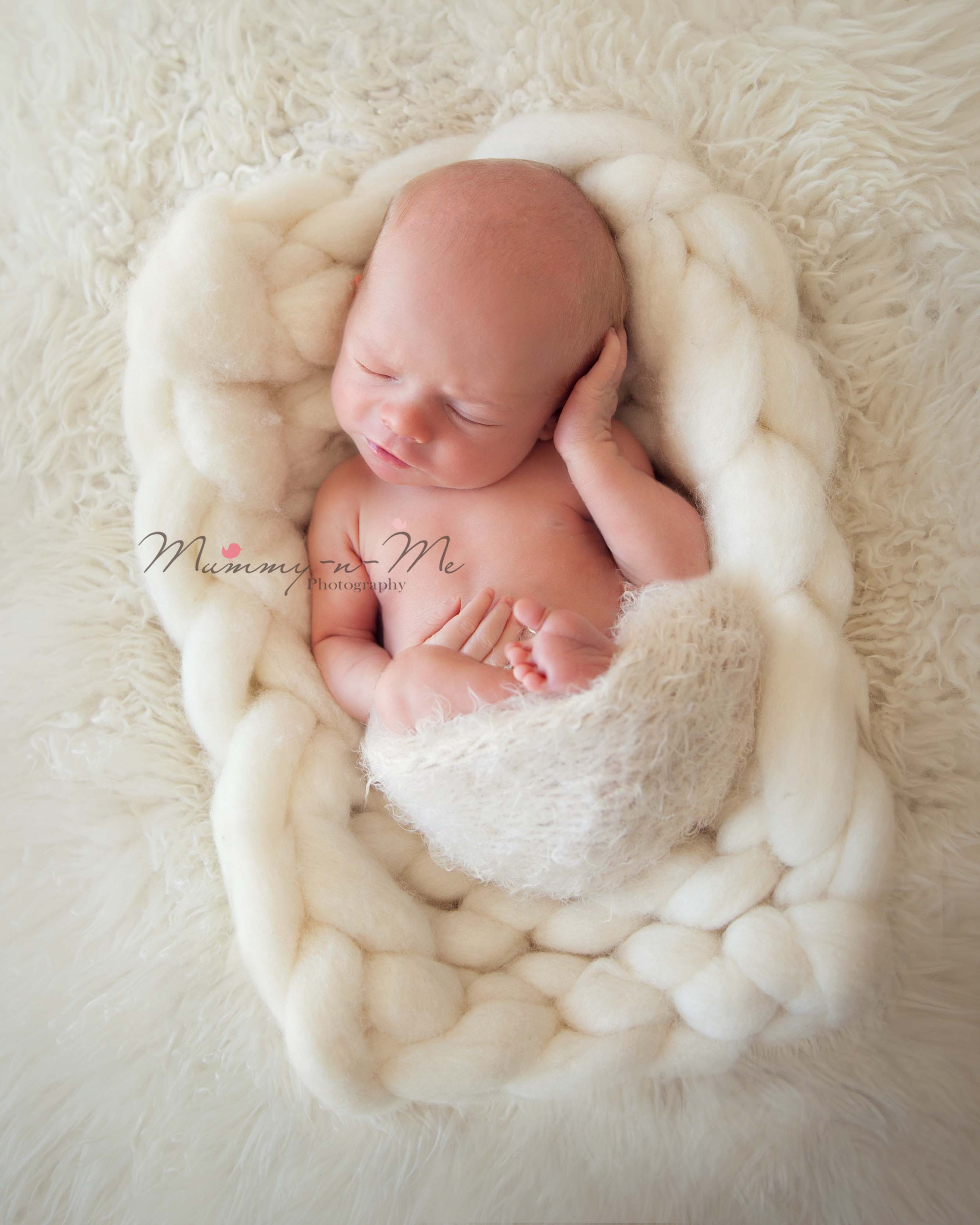 Newborn boy on fur Brisbane newborn photographer