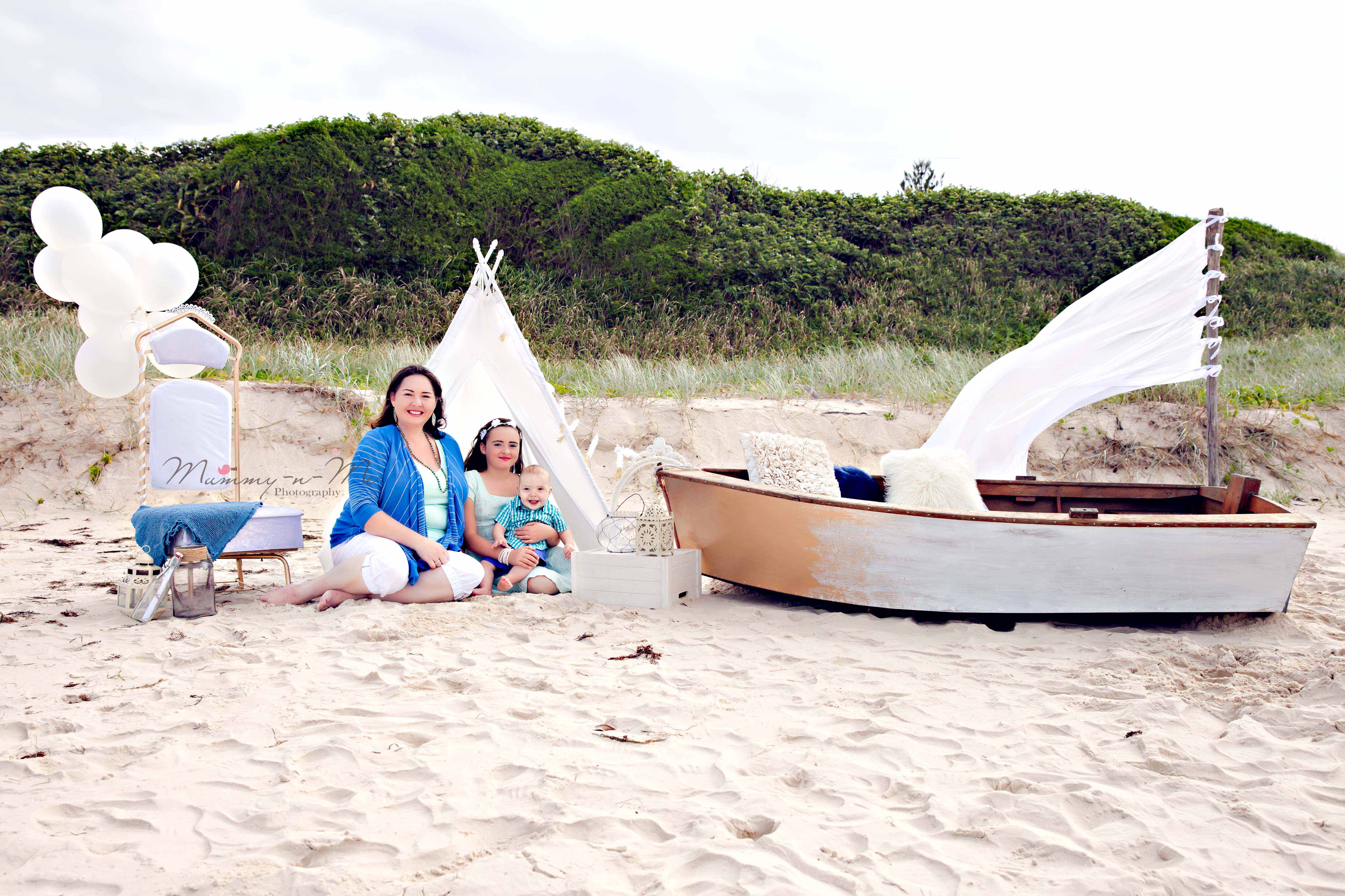 white and gold themed family session at the beach with a boat Brisbane Family Child Baby Themed Photographer