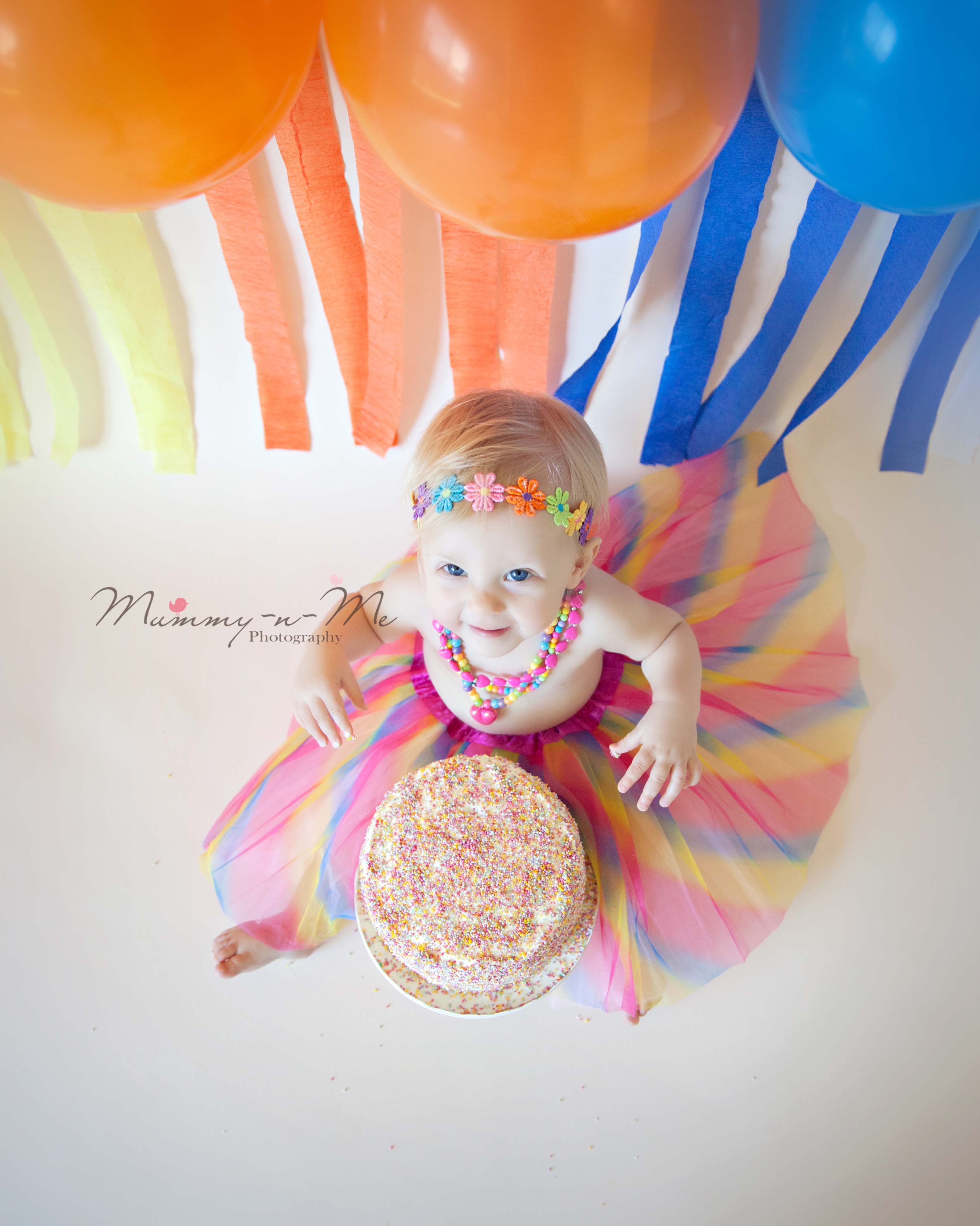 First birthday celebrations little girl rainbow cake smash Brisbane Family Child Cake Smash Photographer