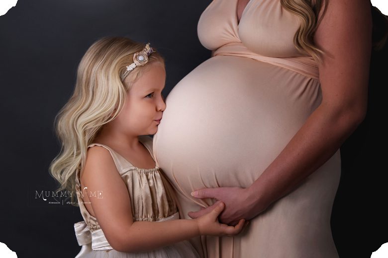 Brisbane Maternity Family Newborn Child Photographer girl kissing pregnant tummy