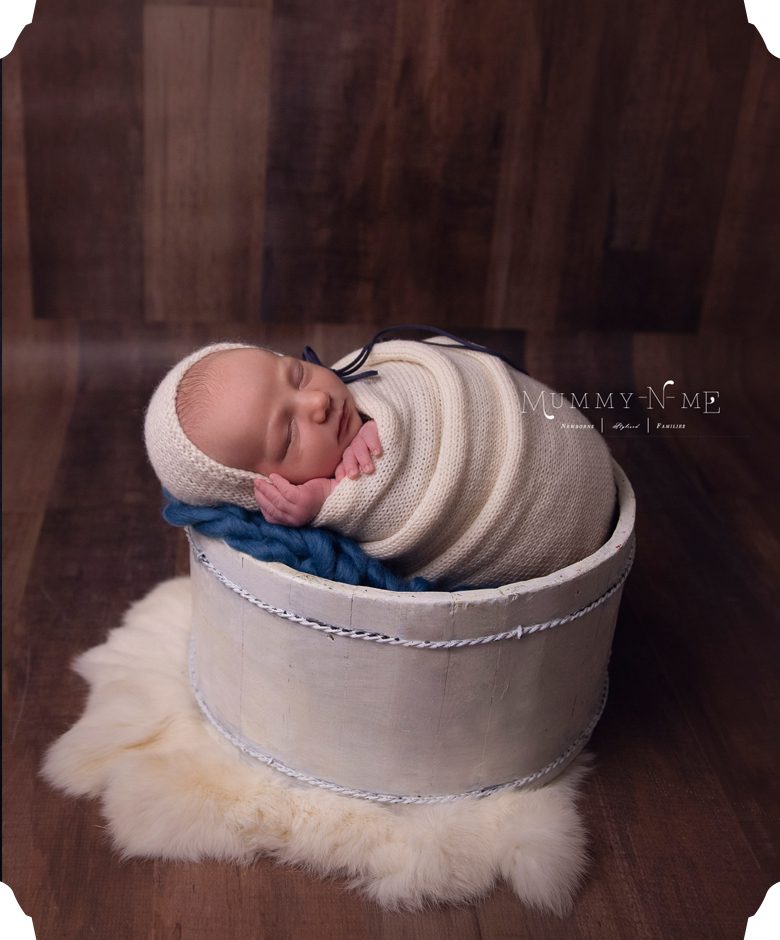 newborn boy in blue and cream brisbane