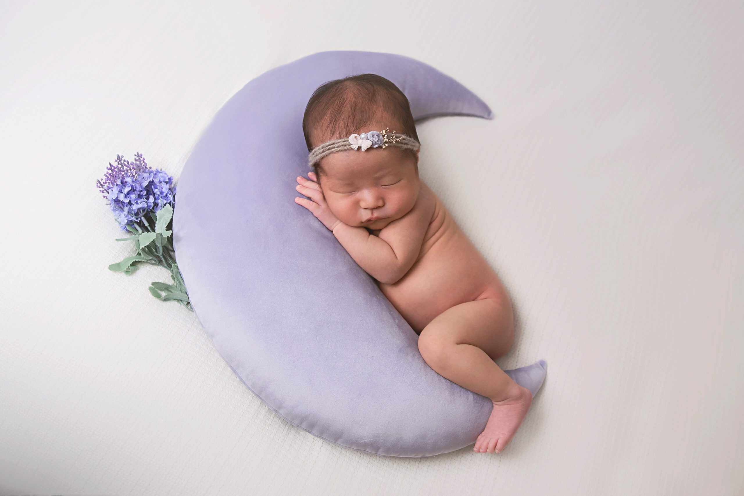 newborn girl in purple